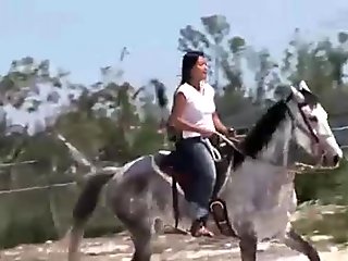 Chick from Thailand riding a horse